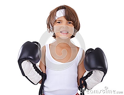 Hes an avid little boxer. Portrait of a young boy in boxing gear looking determined. Stock Photo