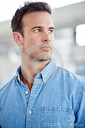 Hes got a great future here. smiling man in a casual work environment. Stock Photo