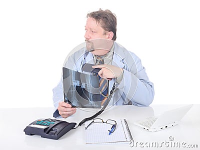 Hesitating orthopedist on phone Stock Photo