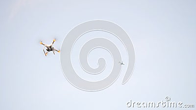 Hexacopter drone flies in the blue sky Stock Photo