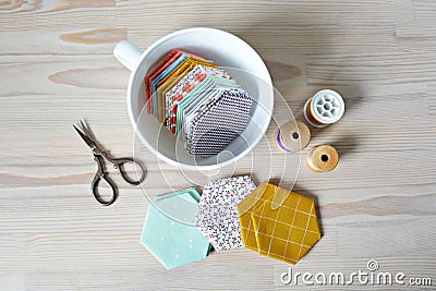 Hexagon patchwork templates, white cup, thread and retro scissors Stock Photo