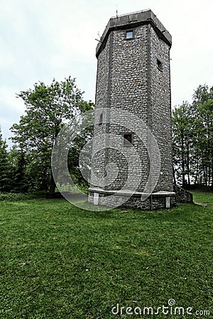 Hexagonal stone outlook tower by woods Stock Photo