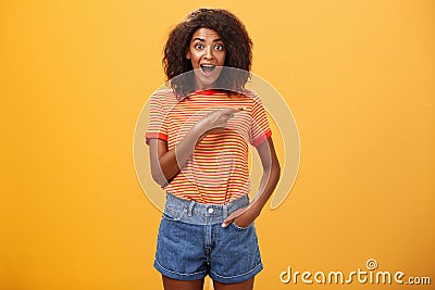 Hey awesme copy space there. Portrait of impressed and surprised enthusiastic young african american female with afro Stock Photo