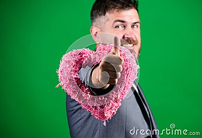 Hey pretty. Spread love around. Happy in love. Romantic macho flirting. Happy valentines day. Hipster hold heart symbol Stock Photo