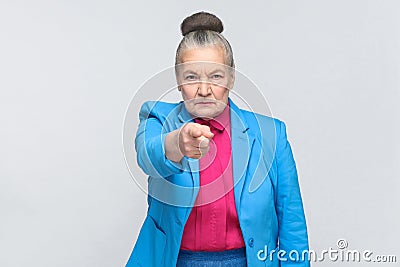 Hey you! Woman pointing at camera finger with serious face Stock Photo