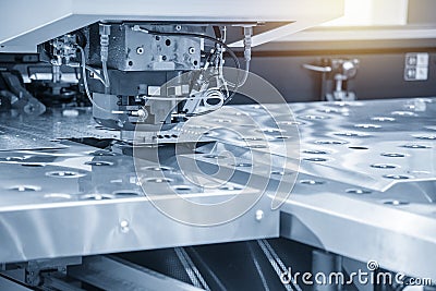 The hi-speed CNC punching machine in light blue scene. Stock Photo