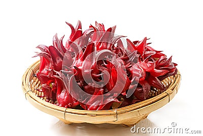 Roselle fruits in bamboo basket, isolated on white Stock Photo
