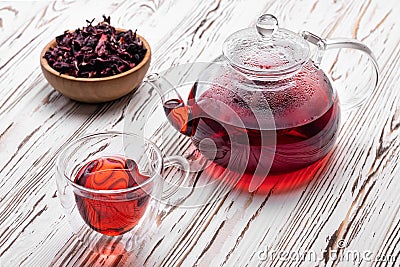 Hibiscus tea in glass teapot and cup Stock Photo