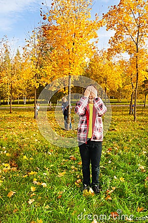 Hide and seek game in the autumn park Stock Photo