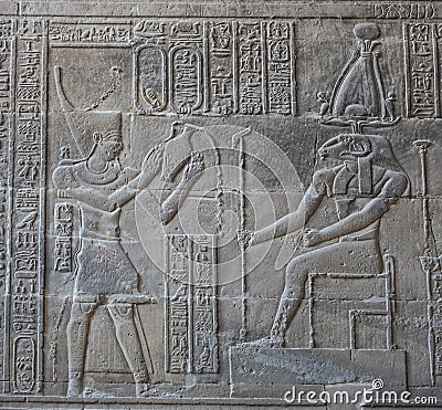 Hieroglyphic carvings on an ancient egyptian temple wall Stock Photo