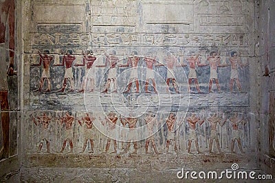 Hieroglyphs in Saqqara necropolis near Cairo in Egypt Editorial Stock Photo