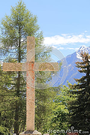 Cross at the churchyard of St FerrÃ©ol d`Huez church, France Stock Photo