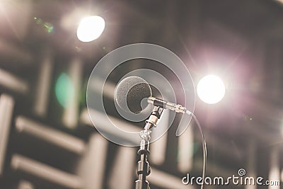 High accuracy microphone in noise sound testing room with LED light bokeh. High technology. Microphone for noise recorder. Stock Photo