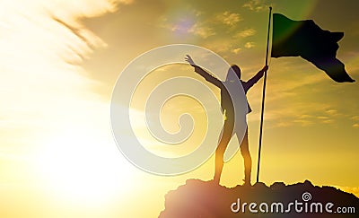 High achievement, silhouettes of the girl, flag of victory on the top Stock Photo