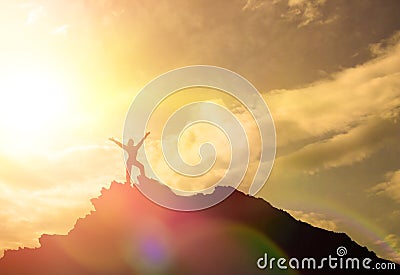 High achievement, the silhouettes of the girl, on the top of the mountain, Stock Photo