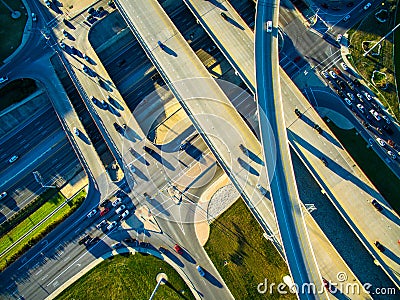 High Aerial Drone view over overpassing interchanges and interstates and highways and roads Stock Photo