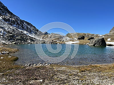 High alpine lakes next to the mountain hut (Chamanna da Grialetsch CAS) in the massif of the Albula Alps Stock Photo