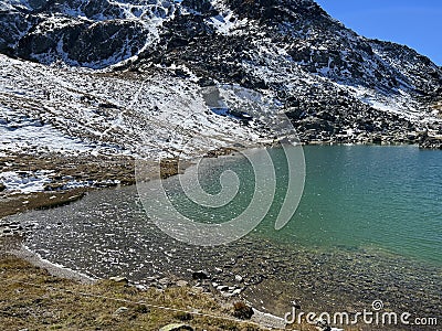 High alpine lakes next to the mountain hut (Chamanna da Grialetsch CAS) in the massif of the Albula Alps Stock Photo