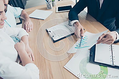 High angle cropped shot of three business partners discussing da Stock Photo