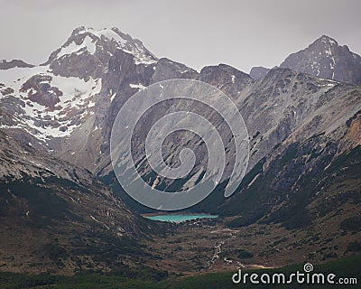 High-angle of Martial mountains lake near cloudy gloomy sky background Stock Photo