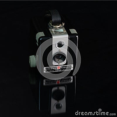 High angle shot of a black vintage brownie hawkeye camera against a black background Editorial Stock Photo