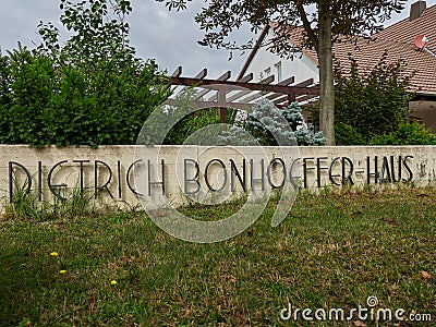 High angle shot of Dieter Bonhoeffer house lettering on a low wall in Steinhagen in Germany Editorial Stock Photo