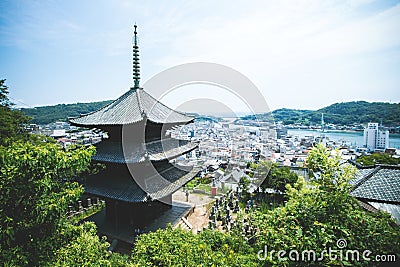 High angle shot of the Japanese pagoda touching the sky in Onomichi, Japan Editorial Stock Photo