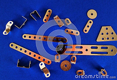 High angle shot of metal details of a mechanism on a blue background Stock Photo