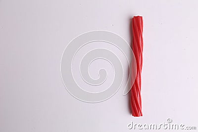 High angle shot of a red stick candy isolated on a white surface Stock Photo