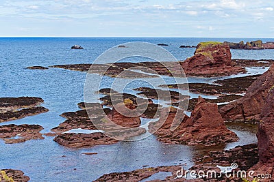 High angle shot of stone formations on the shore of North Berwick, Scotland, UK Stock Photo