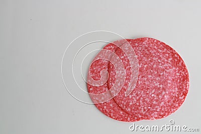 High angle shot of two slices of lunchmeat isolated on a white surface Stock Photo