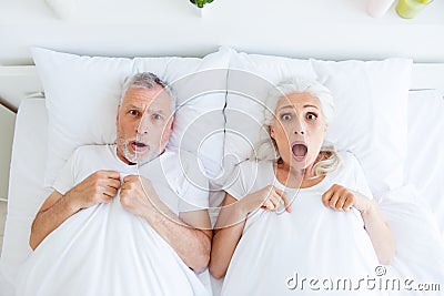 High angle top view surprised couple gray hair people in pajama, Stock Photo