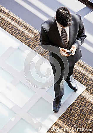 High angle view of businessman with cell phone Stock Photo