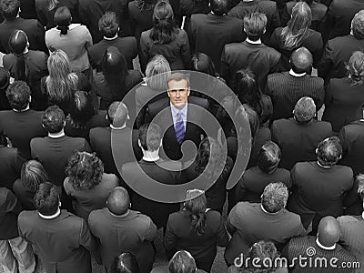 High angle view of a businessman standing amidst businesspeople Stock Photo