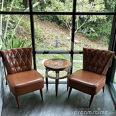 High angle view of chairs and table in room Stock Photo