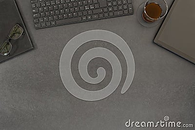 Top view of contemporary black concrete office desk with computer and supplies Stock Photo