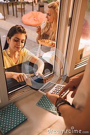 high angle view of customer paying with credit card Stock Photo