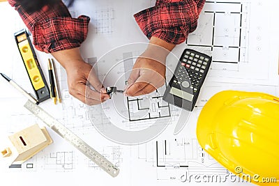 High Angle View Of Engineer Asian Person Drawing Architect Plan On Table Overweight Stock Photo