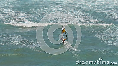 High angle view of a female windsurfer sails at diamond head Stock Photo