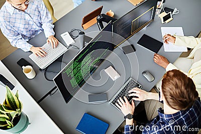 Programmers working on computers at office Stock Photo
