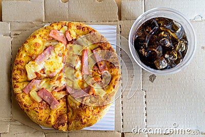 High Angle View Of Hawaiian Pizza And Cola Stock Photo