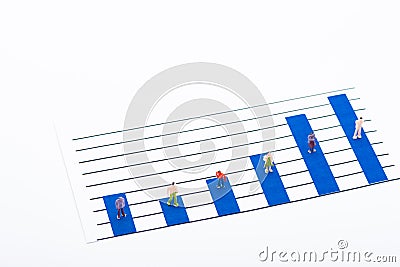 High angle view of people figures on surface of blue graphs isolated on white Stock Photo