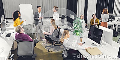 High angle view of professional young multiracial businesspeople working together Stock Photo
