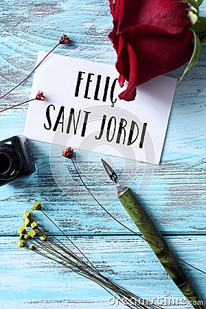 Rose and text happy Saint George Day in Catalan Stock Photo