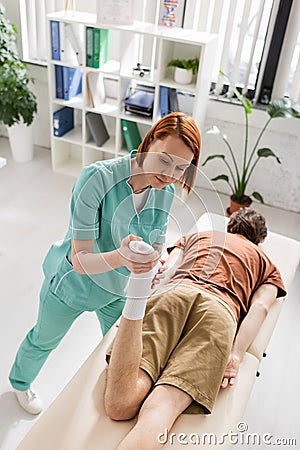 high angle view of redhead chiropractor Stock Photo