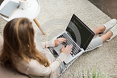 high angle view of young female developer coding with laptop Editorial Stock Photo
