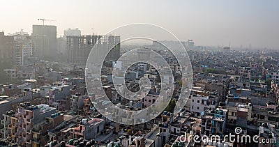 High angle wide shot of a city with slums and skyscrapers under construction Stock Photo