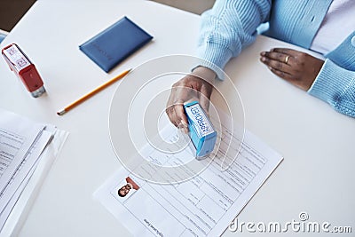 High angle of young African American female manager of visa application center Stock Photo
