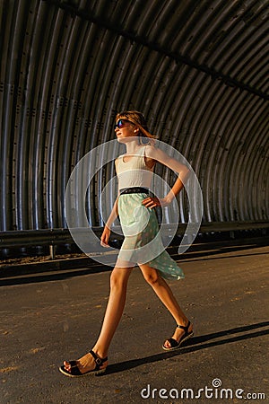 High beautiful teen girl goes through the tunnel Stock Photo
