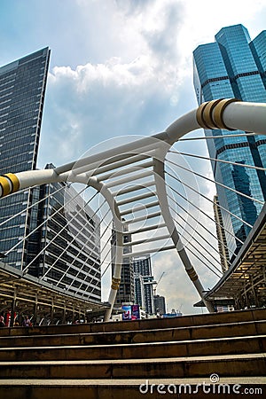 High buildings and public skywalk for transit between Chong Nonsi Bts Station with Sathorn junction business area center. Editorial Stock Photo